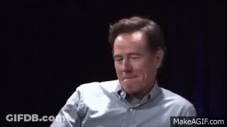 Man In Blue Shirt Making Funny Face And Waving GIF