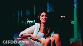 Man In Blue Shirt Making Funny Face In Dark Room GIF
