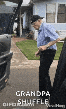 Man In Blue Shirt Next To Car GIF