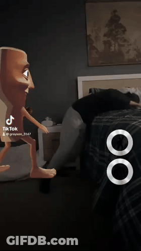 Man In Blue Shirt Next To Cartoon Character With Fist GIF