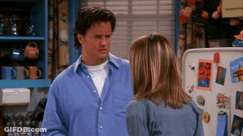 Man In Blue Shirt Next To Woman In Kitchen GIF