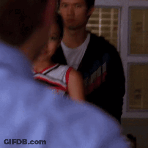 Man In Blue Shirt Next To Woman In Red White And Blue Shirt GIF