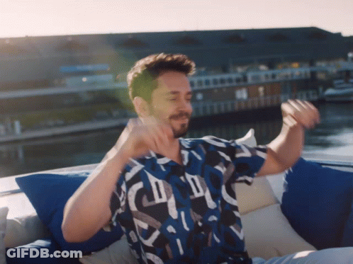 Man In Blue Shirt On Boat Arms Outstretched GIF