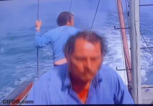 Man In Blue Shirt On Boat GIF