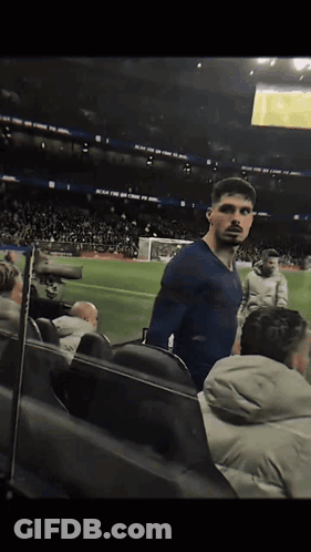 Man In Blue Shirt On Soccer Field Reach For The Sky GIF