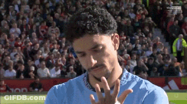 Man In Blue Shirt On Soccer Field With Sky Sports Logo GIF