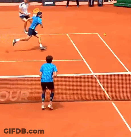 Man In Blue Shirt Playing Tennis GIF