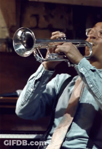 Man In Blue Shirt Playing Trumpet GIF