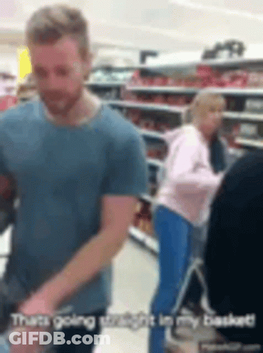 Man In Blue Shirt Pushing Shopping Cart GIF