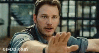 Man In Blue Shirt Reaching Out GIF