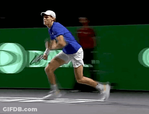 Man In Blue Shirt Running With Tennis Racket GIF