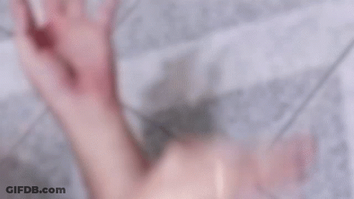 Man In Blue Shirt Saying Gang Lying On Floor With Another Man GIF