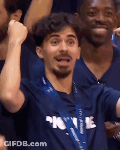 Man In Blue Shirt Saying Home With Fist In Air GIF