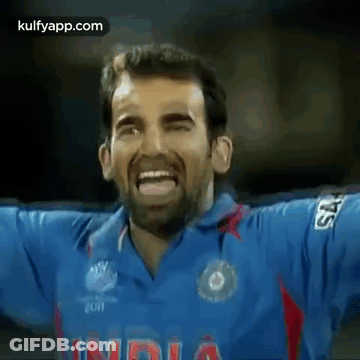 Man In Blue Shirt Saying India Making Funny Face GIF