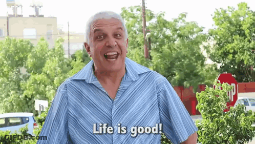 Man In Blue Shirt Saying Life Is Good At Stop Sign GIF