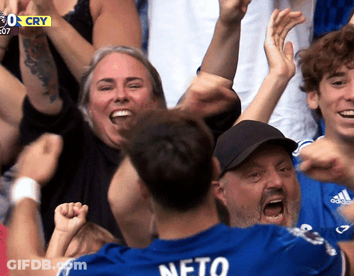 Man In Blue Shirt Saying Neto Surrounded By Fans GIF