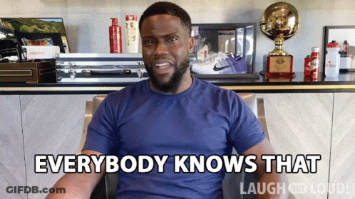 Man In Blue Shirt Says Everybody Knows That In Front Of Trophies GIF