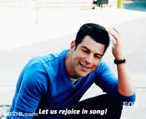 Man In Blue Shirt Singing And Smiling GIF
