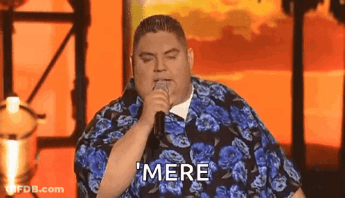 Man In Blue Shirt Singing Into Microphone Saying Mere GIF