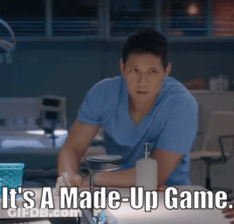 Man In Blue Shirt Sitting At Table Saying It's A Made-Up Game GIF