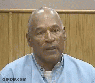 Man In Blue Shirt Sitting GIF