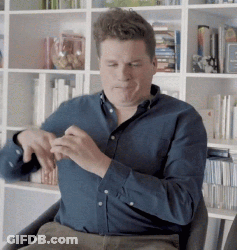 Man In Blue Shirt Sitting Eyes Closed GIF