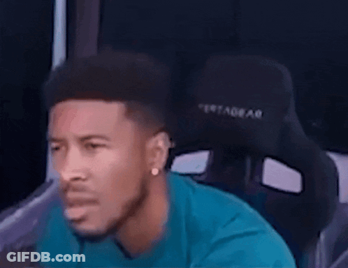 Man In Blue Shirt Sitting In Black Chair GIF