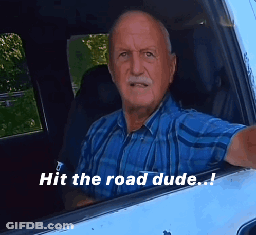 Man In Blue Shirt Sitting In Car Saying Hit The Road Dude GIF