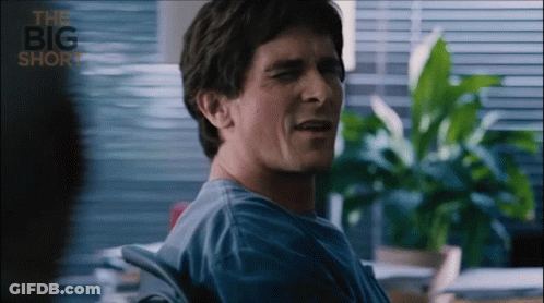 Man In Blue Shirt Sitting In Chair Saying Big Short GIF