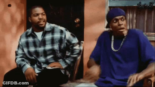 Man In Blue Shirt Sitting Next To Man In Plaid GIF