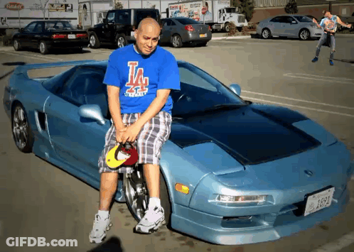 Man In Blue Shirt Sitting On Car Hood GIF