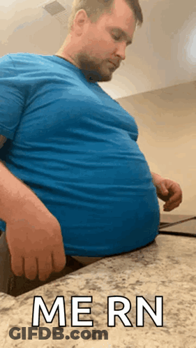 Man In Blue Shirt Sitting On Counter Saying Mern GIF