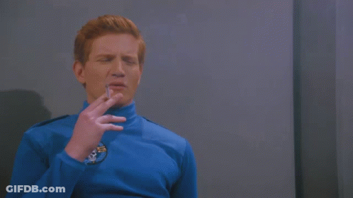 Man In Blue Shirt Smelling Germany GIF