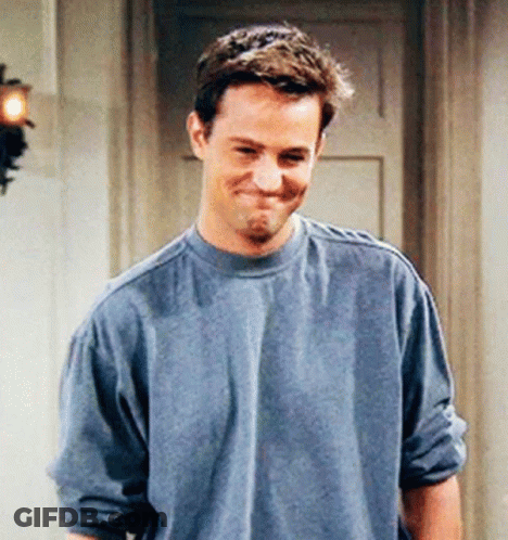 Man In Blue Shirt Smiling And Making Face GIF