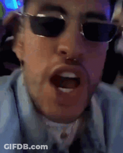 Man In Blue Shirt Smiling And Making Funny Face GIF