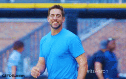 Man In Blue Shirt Smiling At Baseball Stadium GIF