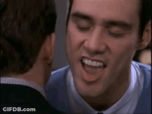 Man In Blue Shirt Smiling At Man In Suit GIF
