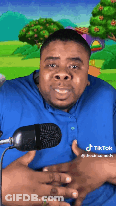 Man In Blue Shirt Smiling At Microphone GIF