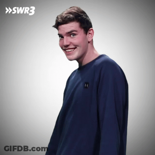Man In Blue Shirt Smiling In Front Of SWR3 Sign GIF