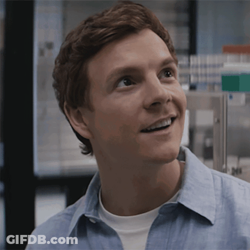 Man In Blue Shirt Smiling In Laboratory GIF