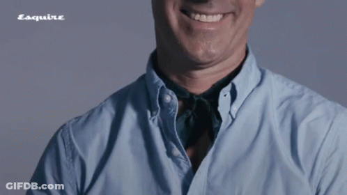Man In Blue Shirt Smiling With Esquire Logo GIF