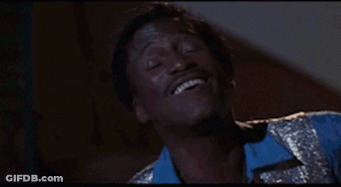 Man In Blue Shirt Smiling With Eyes Closed GIF