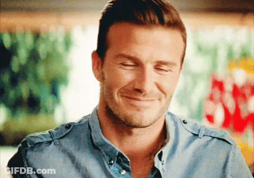 Man In Blue Shirt Smiling With Eyes Closed GIF