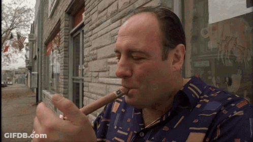 Man In Blue Shirt Smoking Cigar GIF