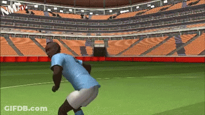 Man In Blue Shirt Squatting On Soccer Field GIF