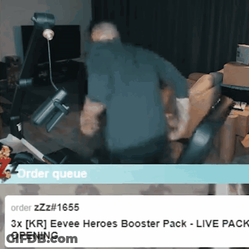 Man In Blue Shirt Standing In Front Of Order Queue Sign GIF