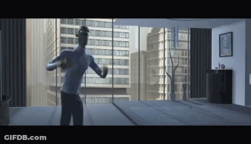 Man In Blue Shirt Standing In Front Of Window In Room GIF