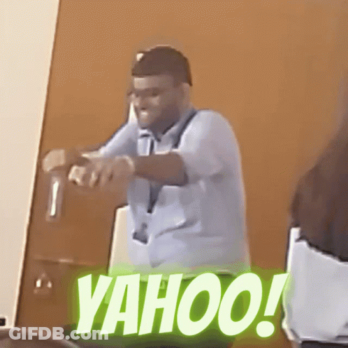 Man In Blue Shirt Standing In Front Of Yahoo Door GIF