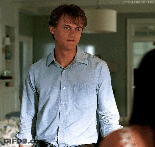 Man In Blue Shirt Standing In Living Room GIF