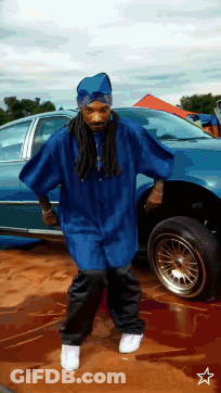 Man In Blue Shirt Standing Next To Car GIF